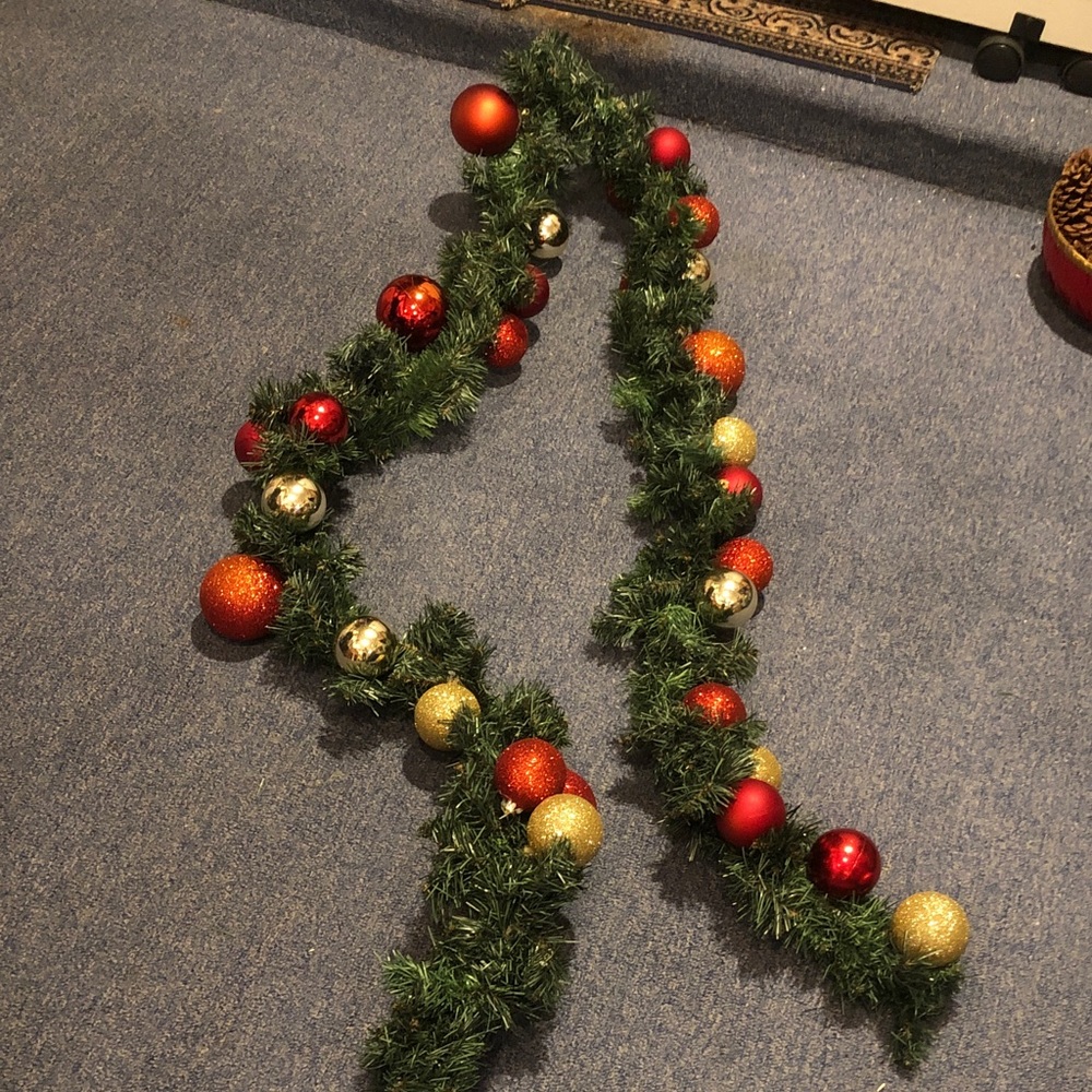 Festive Green Holiday Garland with Red and Gold Ornaments
